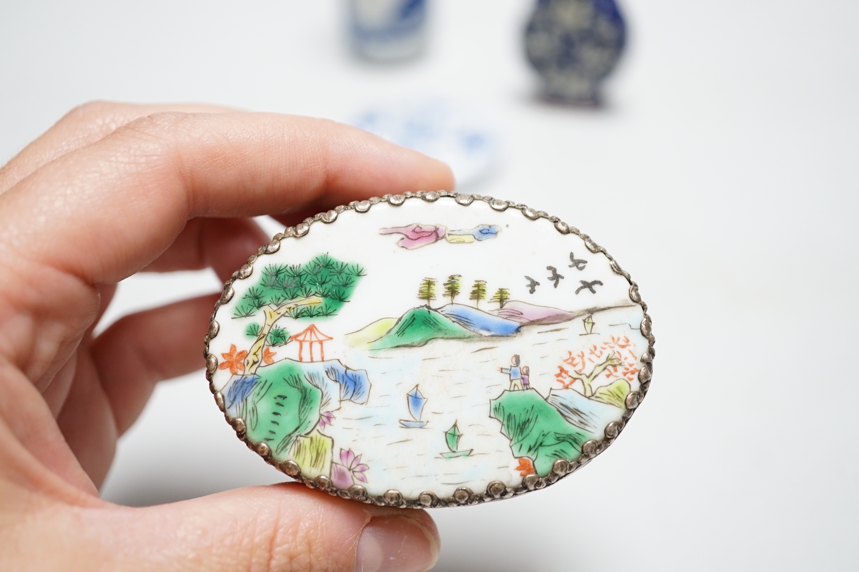 Two Chinese snuff bottles, a porcelain mounted white metal box, mother-of-pearl counters etc